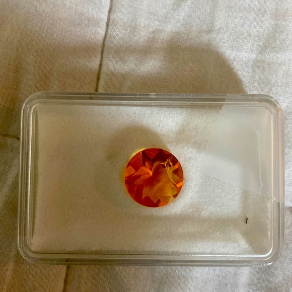 Beautiful brilliant round orange opal 4.45 Ct. solitaire. Fair offers welcome!